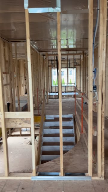 Structural timber framing around a staircase